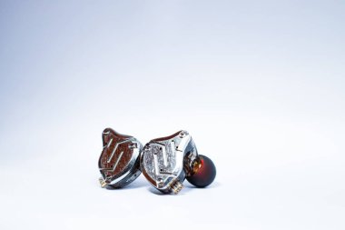 Pair of in-ear monitors without cable on an isolated white background