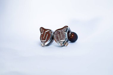 Pair of in-ear monitors without cable on an isolated white background