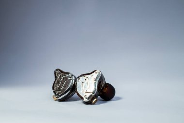 Pair of in-ear monitors without cable on an isolated white background