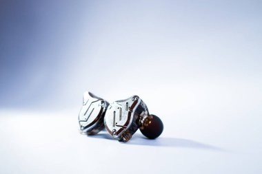 Pair of in-ear monitors without cable on an isolated white background