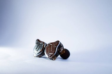 Pair of in-ear monitors without cable on an isolated white background