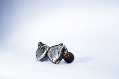 Pair of in-ear monitors without cable on an isolated white background
