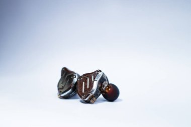 Pair of in-ear monitors without cable on an isolated white background