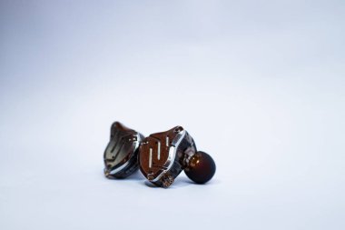 Pair of in-ear monitors without cable on an isolated white background