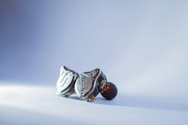 Pair of in-ear monitors without cable on an isolated white background