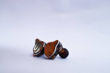 Pair of in-ear monitors without cable on an isolated white background