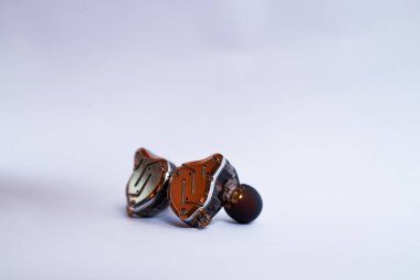 Pair of in-ear monitors without cable on an isolated white background
