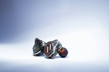 Pair of in-ear monitors without cable on an isolated white background