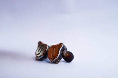 Pair of in-ear monitors without cable on an isolated white background