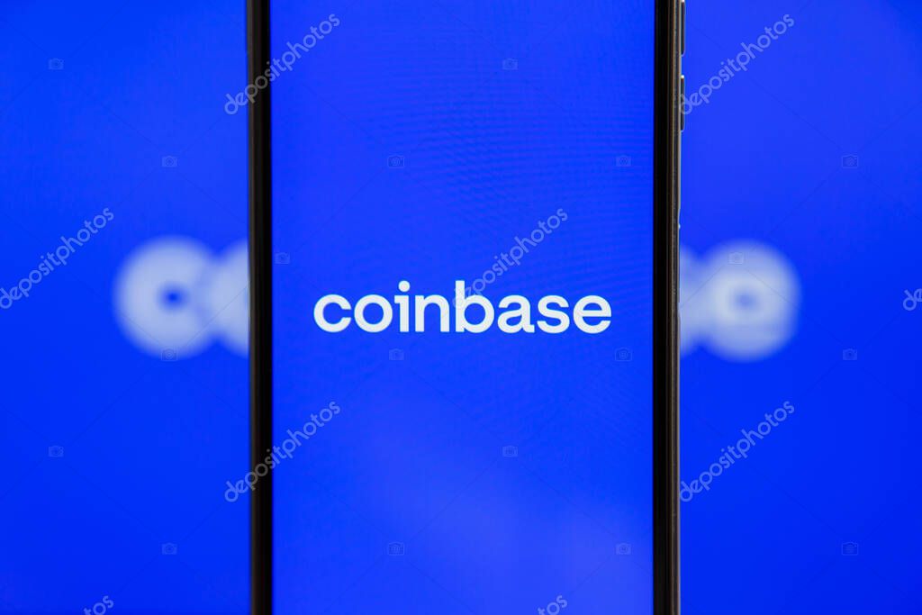 Ukraine, Odessa - October, 9 2021: Coinbase mobile app running at smartphone screen with Coinbase logo at background. Coinbase - American cryptocurrency exchange and trading platform