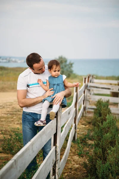Close Small Baby Girl Blue Jeans Dress Sitting Fence Father — Stockfoto