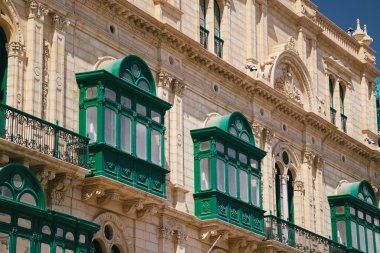 Typical traditional wooden green maltese balconies in the centre of Valletta, capital of Malta. Popular touristic destination and attraction.