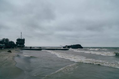 Odessa, Ukraine - November, 22 2019: A shipwreck of a tanker Delfi at the Black Sea coast. Ecological, environmental disaster, oil spill