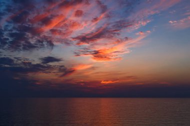A stunning pink and orange sunset sky in the middle of Mediterranean sea, sunset background