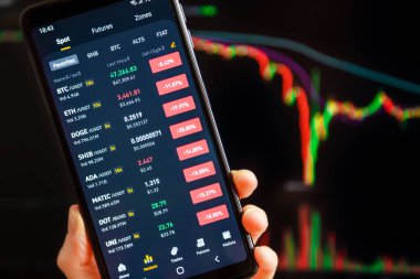 Ukraine, Odessa - September, 7 2021: Bitcoin dump. BTC, ETH, Doge and other altcoins price crashed in red candle and massive sell-off. Binance mobile app running at mobile screen with trading page.