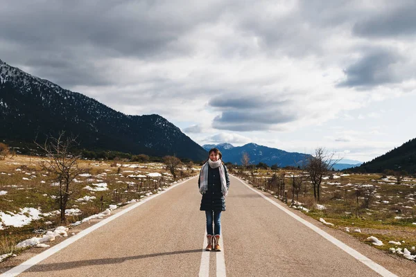 Young Smiling Woman Standing Empty Asphalt Road Middle Mountainous Area — Stockfoto