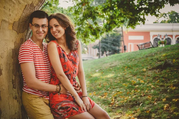 Beautiful Happy Loving Couple Red Clothes Nature Big Tree Embracing — Stockfoto