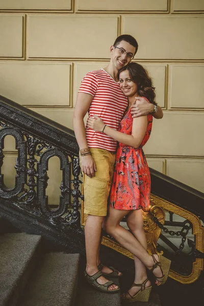 Beautiful Young Couple Outdoors Vintage Stairs Smiling Embracing Looking Camera — Foto Stock