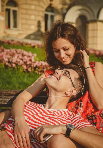 Happy Loving Couple Earphones Sharing Music Smartphone Embracing Outdoors Summertime — Stockfoto