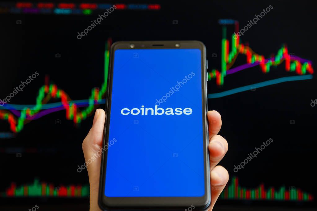 Ukraine, Odessa - October, 9 2021: Coinbase mobile app running at smartphone screen with trading candlestick chart at background. Coinbase is American cryptocurrency exchange and trading platform