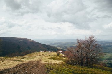 A view from the top of the mountain Gemba or Gimba down to the cablecar, meadow and village Pilipec, Carpathian mountains, Ukraine. Silence and harmony of nature.
