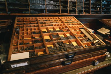 Metal letters for reconstructed wooden Gutenberg's printing machine used for printing souvenir post cards. Located in souvenir shop, museum in Bled Castle on lake Bled in Slovenia.