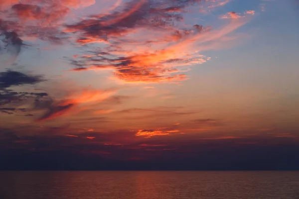 A stunning pink and orange sunset sky in the middle of Mediterranean sea, sunset background