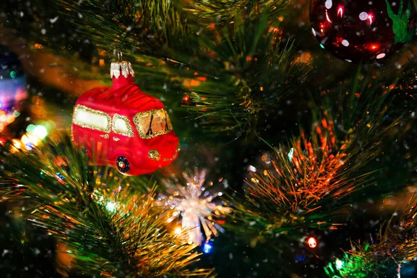 Decorated Christmas Tree Close Red Christmas Toy Car Illuminated Garland — Zdjęcie stockowe