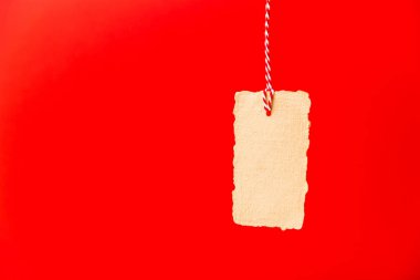 Blank craft vintage price tag isolated on red background. Black friday, sale, discount concept