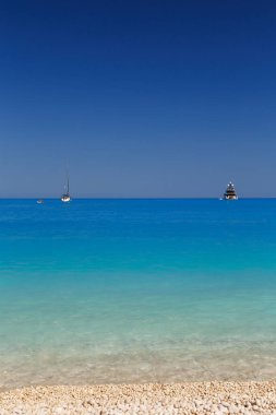 Close up view at Myrtos Beach with turquoise and blue water. Greek islands. Summer scenery of famous and extremely popular travel destination in Cephalonia, Greece, Europe