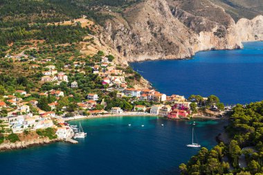 Top view at Asos village, Assos peninsula and fantastic blue Ionian Sea water. Aerial view, summer scenery of famous and extremely popular travel destination in Cephalonia, Greece, Europe