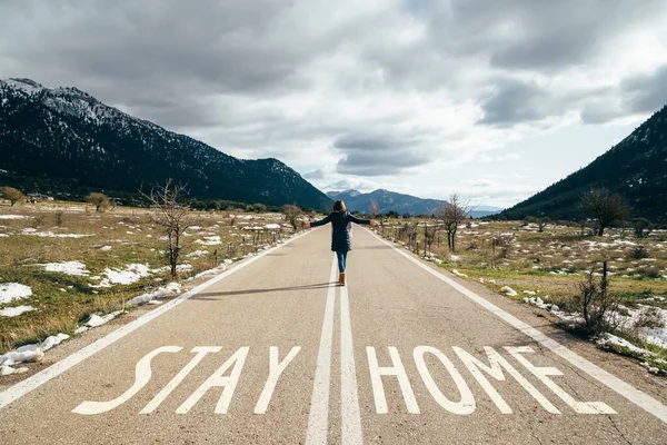 Young Woman Walking Middle Road Raised Hands Road Warning Sign — стоковое фото