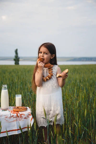 Fun Portrait Cute Little Girl White Dress Eating Bagels Milk — Stock Photo, Image
