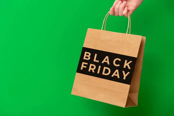 Black Friday Female Hand Holding Brown Craft Shopping Bag Isolated — Foto de Stock