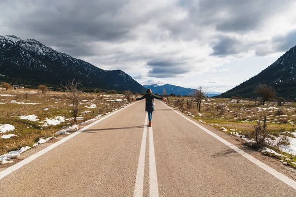 Back View Young Woman Walking Empty Asphalt Road Middle Mountainous — Stockfoto