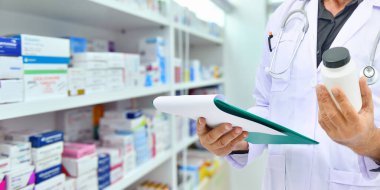 Pharmacist filling prescription in pharmacy drugstore clipart