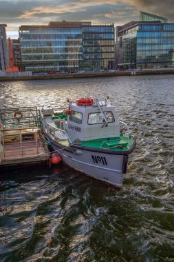 Small ship at River Liffey, Walking along River Liffey in pandemium, Spencer Dock, 4 December, 2021, Dublin , Ireland