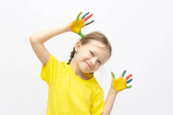 Happy cute little girl with colorful painted hands isolated on a white education concept — Stock Photo, Image