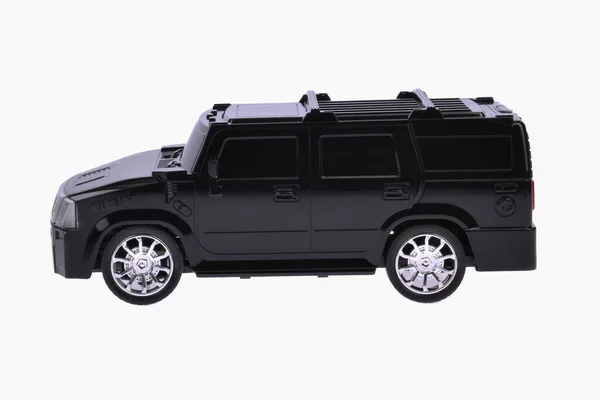 Toy black car on a white background