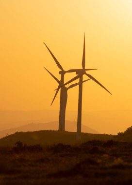 wind generators in the mountains of the Basque Country at sunset. High quality photo
