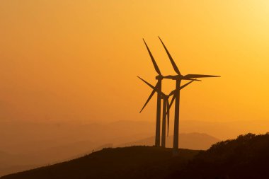 wind generators in the mountains of the Basque Country at sunset. High quality photo