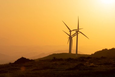 wind generators in the mountains of the Basque Country at sunset. High quality photo