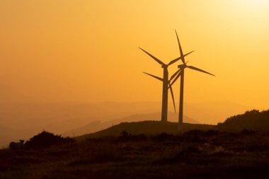 wind generators in the mountains of the Basque Country at sunset. High quality photo