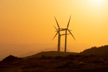 wind generators in the mountains of the Basque Country at sunset. High quality photo