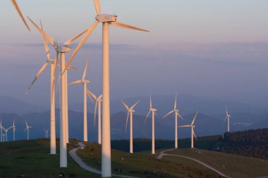 wind generators in the mountains of the Basque Country at sunset. High quality photo clipart