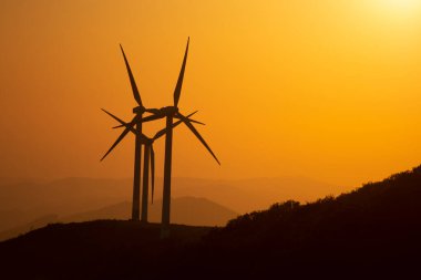 wind generators in the mountains of the Basque Country at sunset. High quality photo