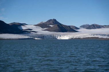 landscape view of an ice glacier in Svalbard islands, in the arctic sea . High quality photo