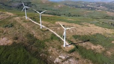 eolic generators spining with the wind in the mountains on a sunny day. High quality 4k footage