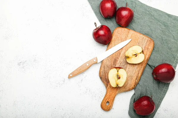 fresh apples on a cutting board on a stone background .Top view