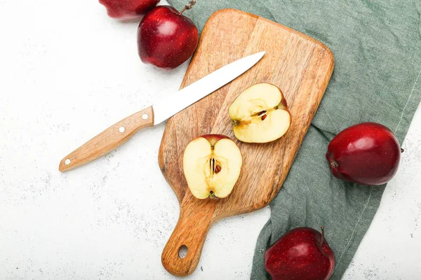 fresh apples on a cutting board on a stone background .Top view